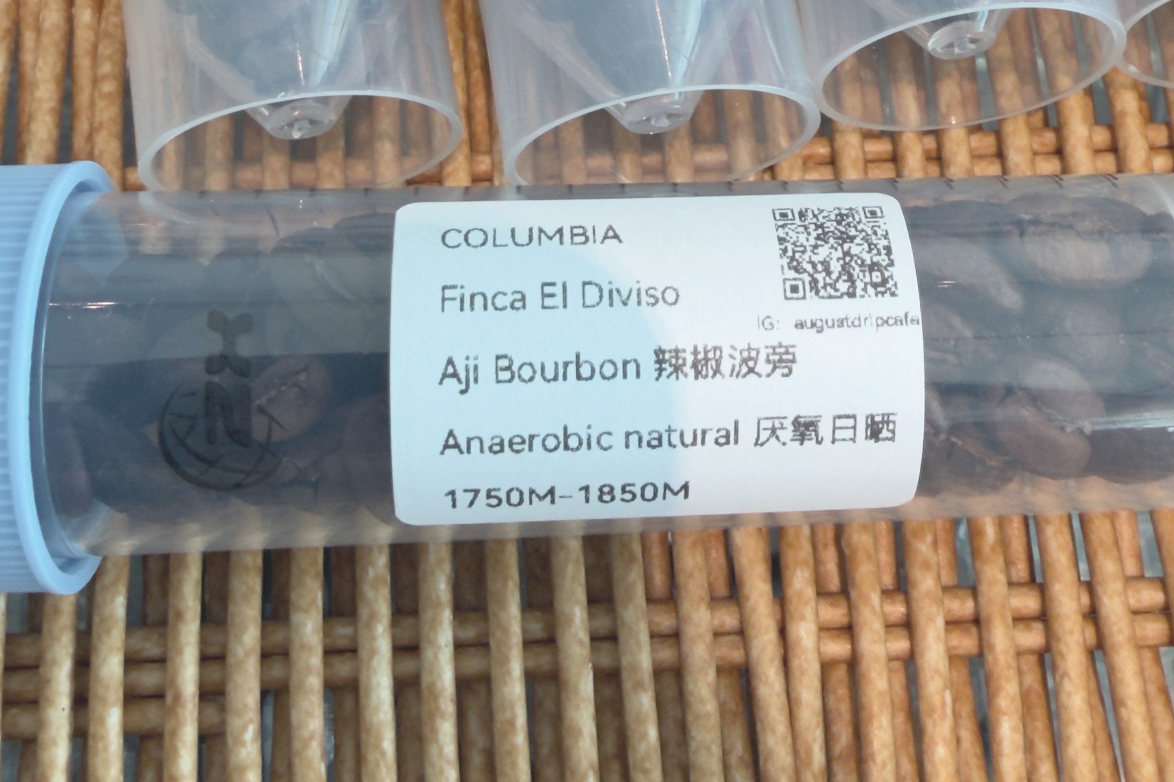 Sample tubes of coffee labelled Colombia, Finca El Diviso, Aji Bourbon, anaerobic natural, 1750 to 1850 metres